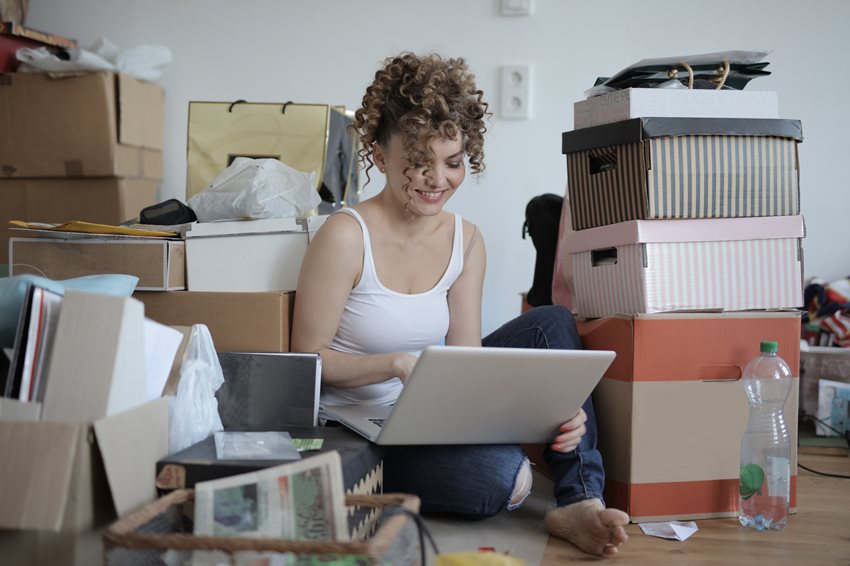 female-shopaholic-with-laptop-shopping-online-in-messy-3791614-(1).jpg