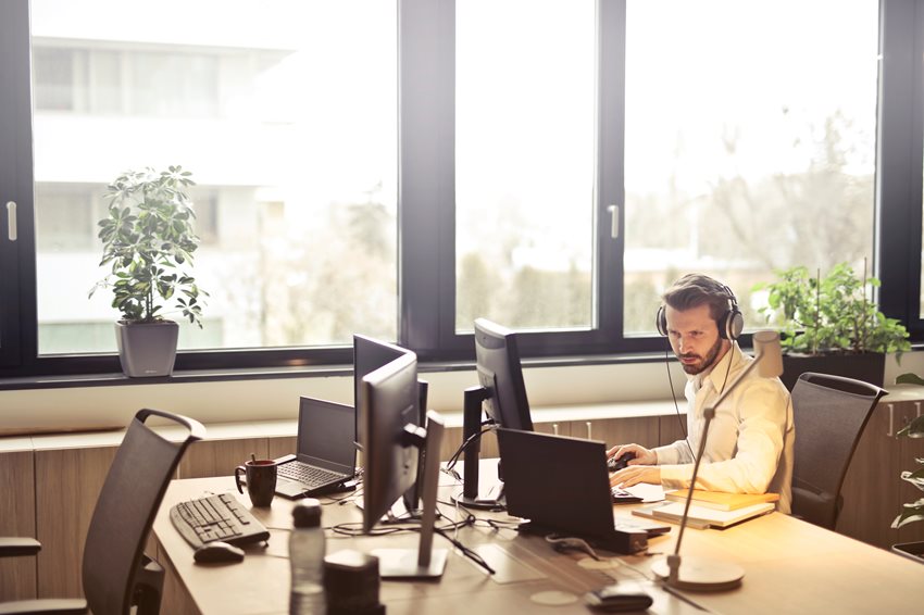 man-with-headphones-facing-computer-monitor-845451.jpg